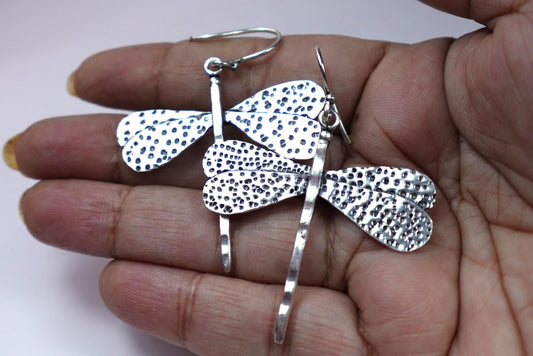 Textured Brass Dragonfly Earrings - Nature-inspired dangle earrings with hammered dragonfly motifs in antique brass.