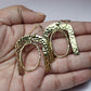 Hammered Horseshoe Brass Earrings - Statement earrings with a bold arch and hammered finish in gold-tone brass.