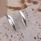 Sleek Nova Ovals - Polished Silver Long Oval Earrings – Ultra Minimal Chic.