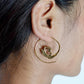 Boho Spiral Shell Hoops - Swirl-Pattern Brass Earrings with Ethnic Touch.