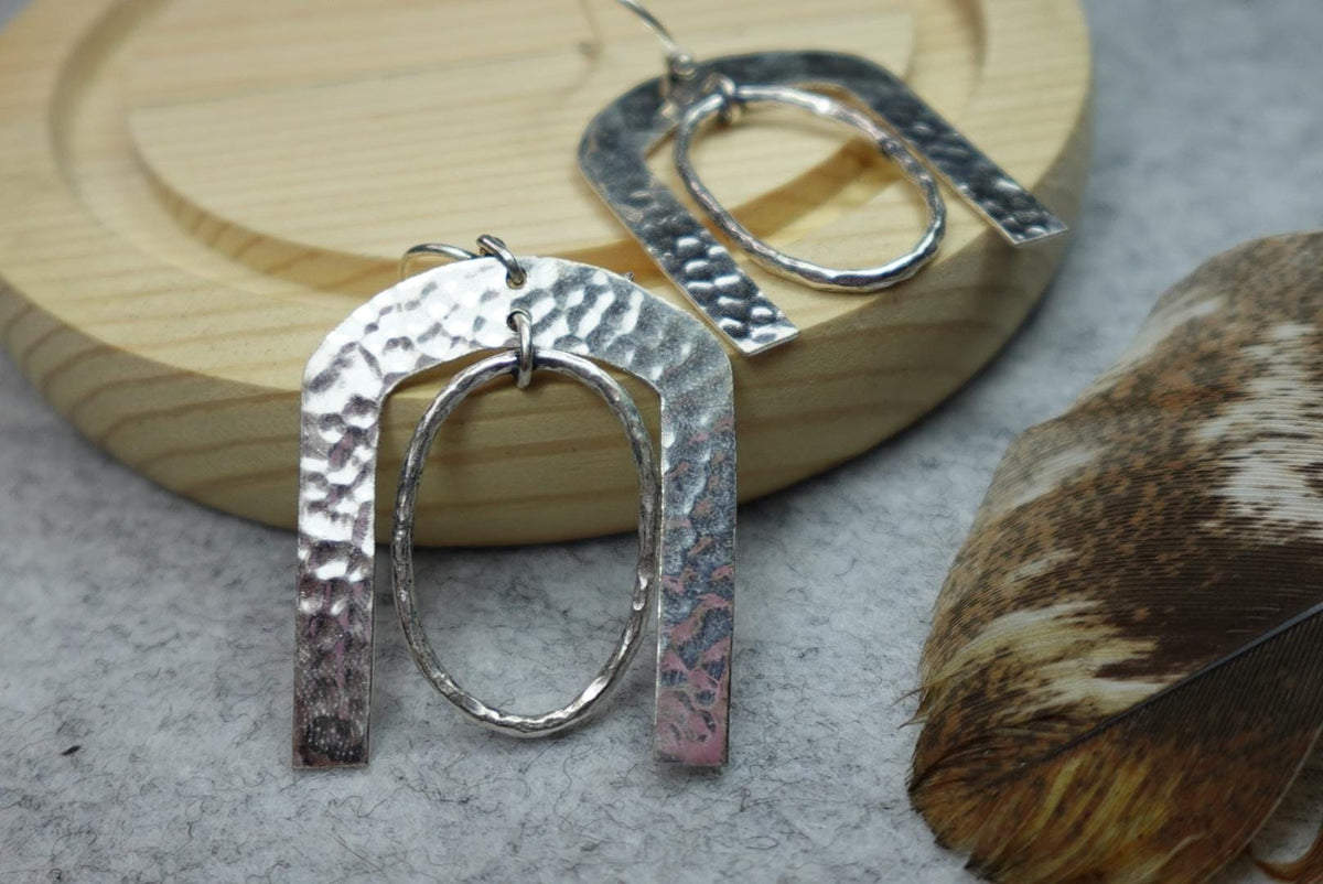 Hammered Horseshoe Brass Earrings - Statement earrings with a bold arch and hammered finish in gold-tone brass.
