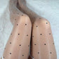 Polka dot white oil shine stockings.