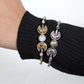 Double Moonstone Lunar Cuff Bracelet - Brass and silver cuffs with crescent moons and moonstones—mystical and chic.