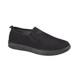 Black slip-on shoe on a white background