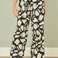 Yumi Black Cotton Splash Print Relaxed Fit Trousers
