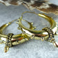 Steampunk Brass Spike Hoop Earrings - Chunky brass hoops with spike details and a bold steampunk aesthetic.