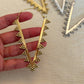 Zahara Spike Hoops - Edgy Brass Triangle Hoops with Boho Desert Vibes.