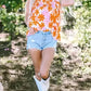 Orange Smocked Floral Top – Ruffled Short Sleeves